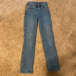Mid-high rise Wrangler womens jeans, size 0/34, lighter wash with a slimmer fit!